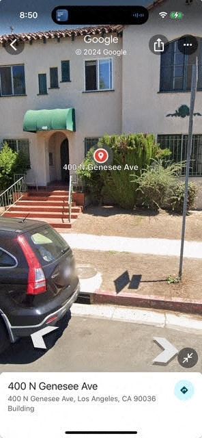 Los Angeles apartment for rent - A black car is parked on the side of the street.