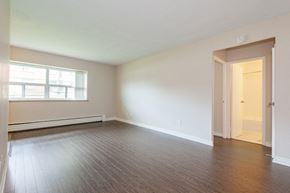 Hamilton apartment for rent - A room with a wooden floor and a door.