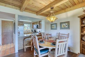 Pagosa Springs apartment for rent - A wooden dining room with a table set for a meal.