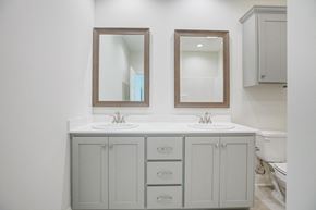 Youngsville house for rent - A bathroom with a white counter top and a white sink.