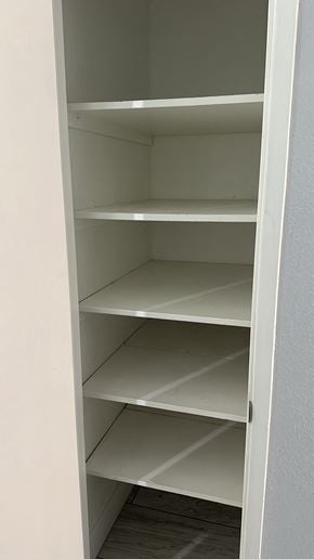 Fresno apartment for rent - Empty white shelves in a pantry.