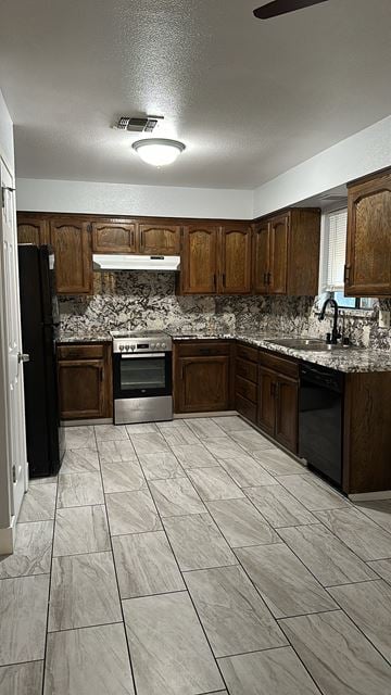 Fresno apartment for rent - A kitchen with wooden cabinets and a black refrigerator.