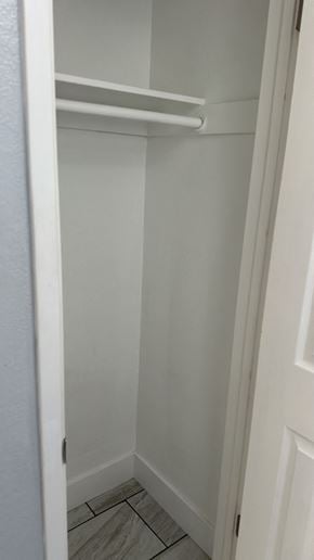 Fresno apartment for rent - A white closet with a shelf and a door.