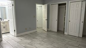 Fresno apartment for rent - A room with white doors and a tiled floor.