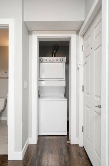 Minneapolis apartment for rent - A white oven and dishwasher are built into a wall in a kitchen.