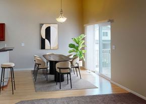 West Fargo townhouse for rent - A modern dining room with a round table and chairs.