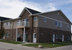 West Fargo apartment for rent - a brick house with a balcony on the side