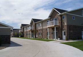 West Fargo apartment for rent - an empty street in front of a row of houses