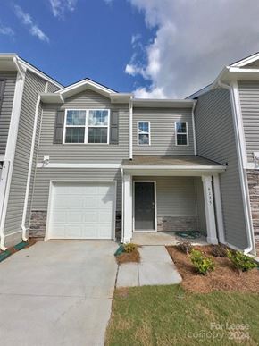 Charlotte house for rent - A two-story house with a garage is for lease.