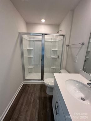 Charlotte house for rent - A bathroom with a sink, toilet, and shower.