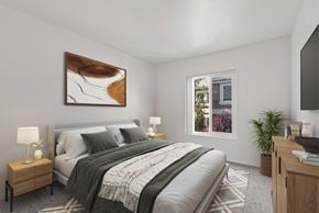 Reno apartment for rent - A bedroom with a large bed and a painting on the wall.