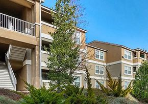 Reno apartment for rent - A multi-story residential building with a balcony on the second floor.