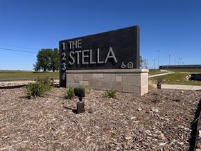 Grinnell apartment for rent - A sign for The Stella with a black background and white lettering.