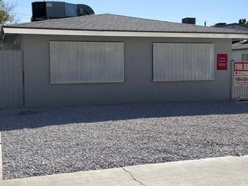 Las Vegas apartment for rent - A house with a sign that says "For Rent" on the right side.