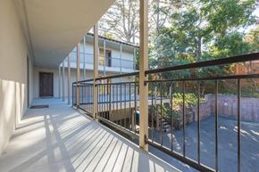 San Bruno apartment for rent - a balcony with a view of a yard and a building