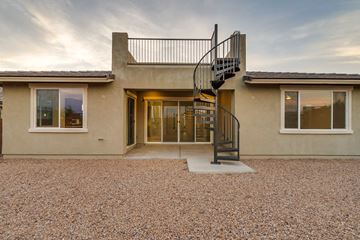 Marana house for rent - A house with a spiral staircase leading to the entrance.