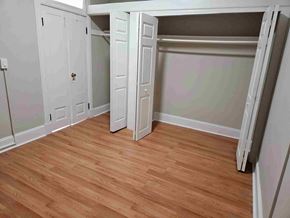 Frederick apartment for rent - A room with a wooden floor and white walls.