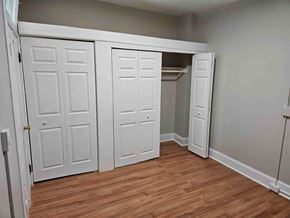 Frederick apartment for rent - A room with a white door and a wooden floor.