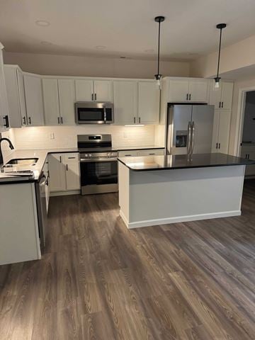 Mccomb apartment for rent - A kitchen with white cabinets and a wooden floor.