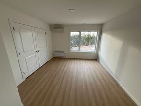 Guysborough apartment for rent - A room with wooden flooring and white walls.
