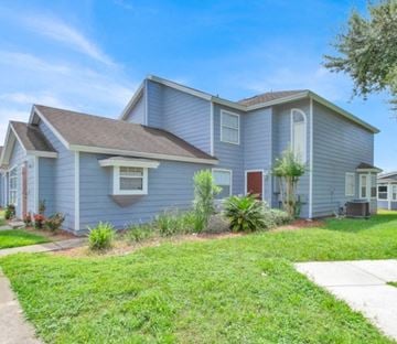 Davenport apartment for rent - A house with a grey siding and a brown roof.