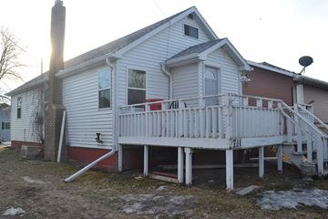 Manvel house for rent - A house with a white porch and a red door.