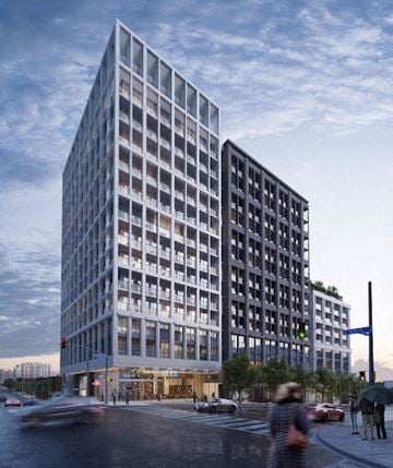 Toronto apartment for rent - A modern glass building with a street in front of it.