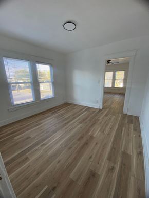 Louisville apartment for rent - A room with wooden flooring and a window.