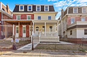 Philadelphia apartment for rent - A house with a red door is in front of a house with a white door.