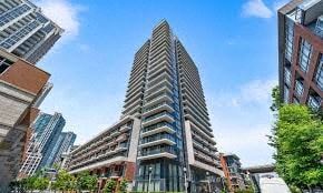 Toronto apartment for rent - A tall building with a unique design stands out among other buildings.