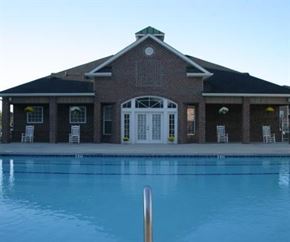 Greenville apartment for rent - a large swimming pool in front of a building