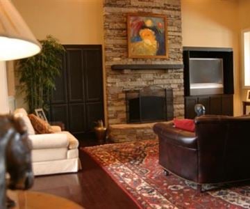 Greenville apartment for rent - a living room with a fireplace and a couch