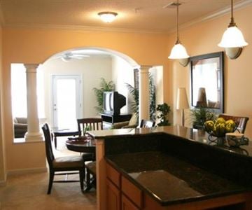 Greenville condo for rent - A kitchen with a black counter top and a brown chair.