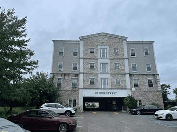 Hackensack apartment for rent - A building with the name "B Essex Street" is visible with cars parked in front.
