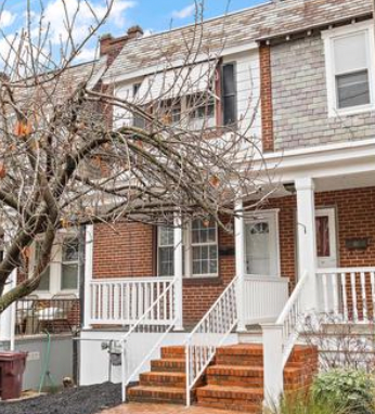 Wilmington house for rent - A house with a white front porch and a tree in front.