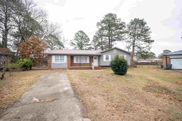 Fayetteville house for rent - A house with a driveway in front of it.