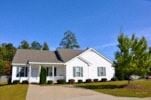 Raleigh apartment for rent - A white house with a grey roof and a porch.