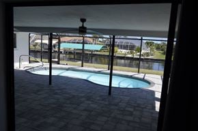 Cape Coral house for rent - A pool with a fence around it.