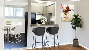 Royal Oak apartment for rent - Gray matte cabinets top the bistro kitchen with stainless or jet black appliances, luxe plank flooring.