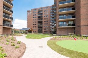 Burlington apartment for rent - A red flag is on a small green lawn.