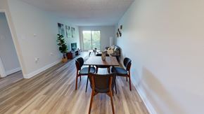 Guelph apartment for rent - A dining room with a wooden table and chairs.