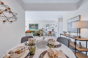 Farmington Hills apartment for rent - A dining room with a white table set for a meal.