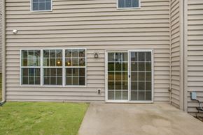 Chambersburg apartment for rent - A house with a grey siding and a glass door.