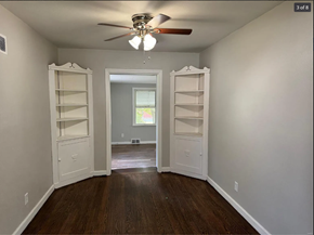 St. Louis house for rent - A room with a ceiling fan and two open doors.