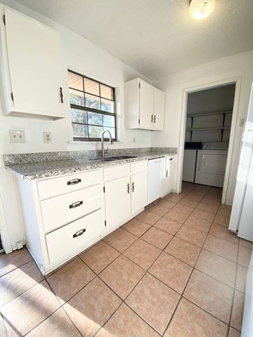 Lafayette house for rent - A kitchen with white cabinets and a granite countertop.