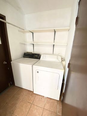 Lafayette house for rent - A small laundry room with a washer and dryer.