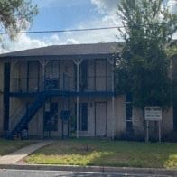 El Campo apartment for rent - A building with a sign in front of it.