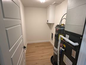 Benton City apartment for rent - A room with a wood floor and a wall-mounted air conditioning unit.