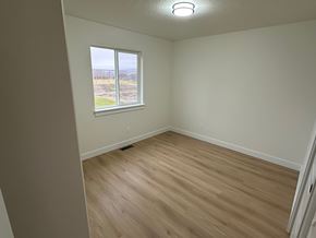 Benton City apartment for rent - A room with a window and wooden flooring.