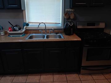 Baltimore apartment for rent - A kitchen with a sink and a stove.
